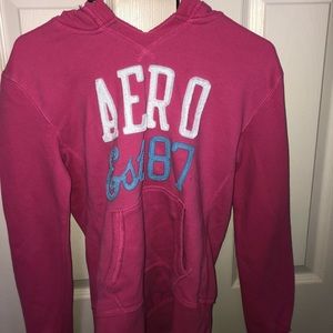 Pink throw over aero sweater